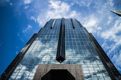 Low angle view of skyscraper against sky