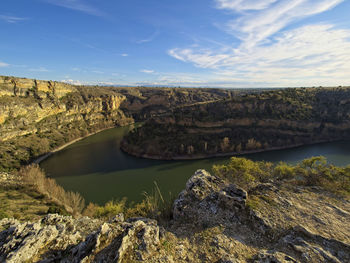 Scenic view of rock formations against sky