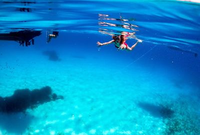 People swimming in sea