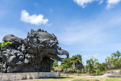 Statue against blue sky