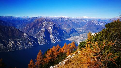 Scenic view of snowcapped mountains against blue sky