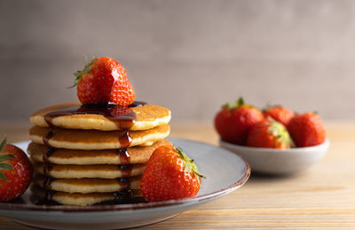 Close-up of fruits in plate on table