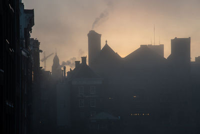 Cityscape against sky during sunset