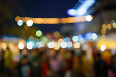 Defocused image of illuminated lights at night