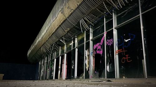 Graffiti on old building at night