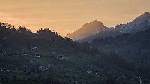 Scenic view of landscape against sky during sunset