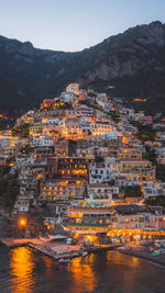 High angle view of illuminated buildings in city at night