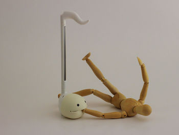 Close-up of stuffed toy on table against white background