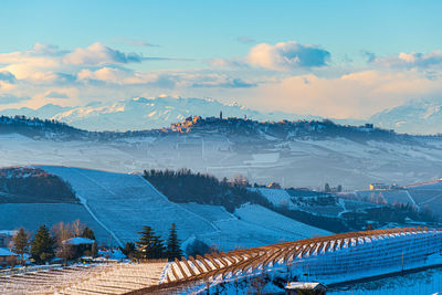 High angle view of snowcapped mountains against sky