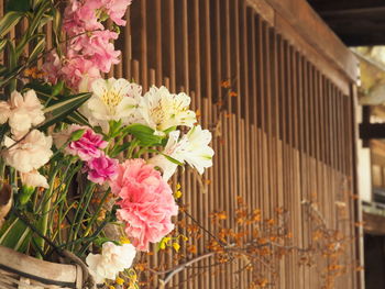 Close-up of pink flower pot on plant