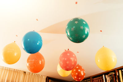 Close-up of christmas decorations hanging on table