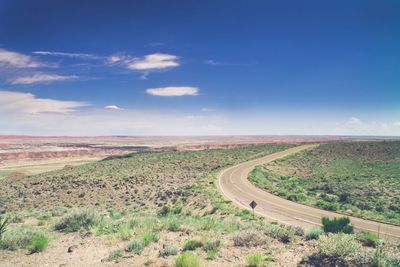 Road passing through field