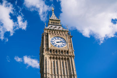 Low angle view of clock tower against sky