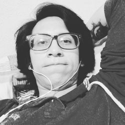 Close-up portrait of young man with eyeglasses