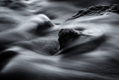 Close-up of water flowing through rocks