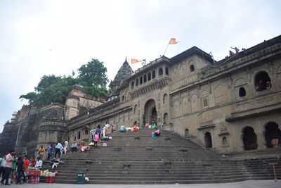 Group of people in front of historic building