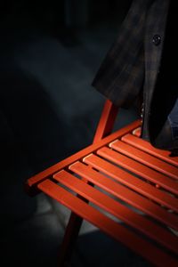 High angle view of person standing on chair