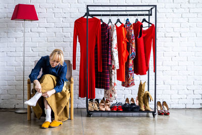 Women wearing shoes while sitting on chair