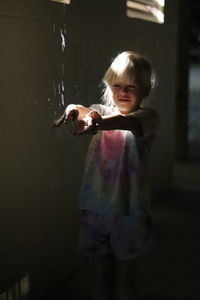 Portrait of boy playing at home