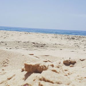 Scenic view of beach against clear sky