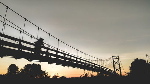 Silhouette of bridge against sky