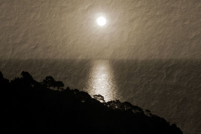 Scenic view of sea against sky at night