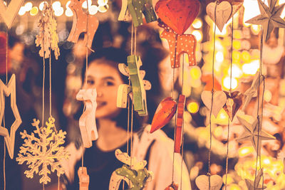 Close-up of illuminated lanterns hanging at market stall