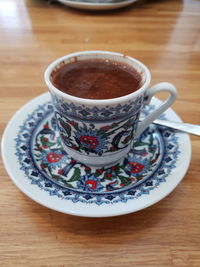 High angle view of coffee cup on table