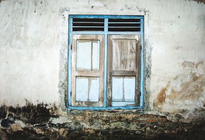 Closed window of old building