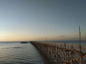 Scenic view of sea against clear sky during sunset