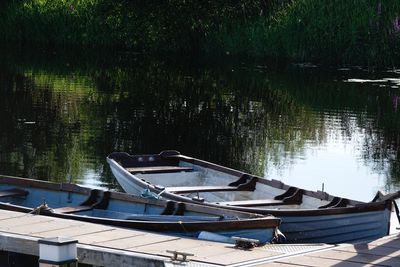 Boats moored in lake