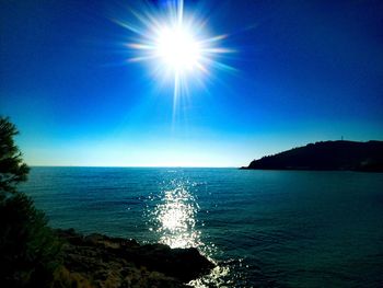 Scenic view of sea against clear blue sky