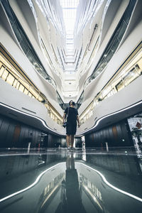 Woman walking on road