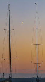 Silhouette of sailboat against sky during sunset