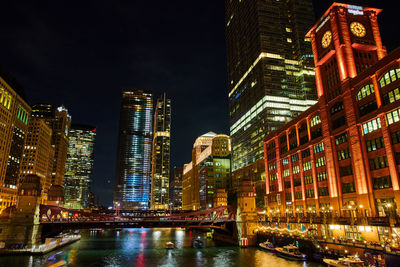 Illuminated buildings in city at night