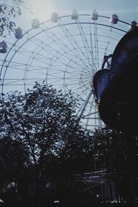 Low angle view of ferris wheel against sky