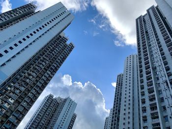 Low angle view of buildings against sky in city