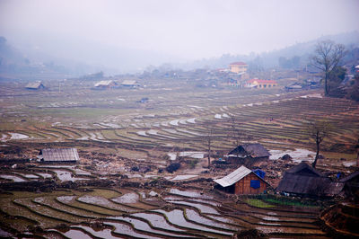 High angle view of houses and buildings against sky