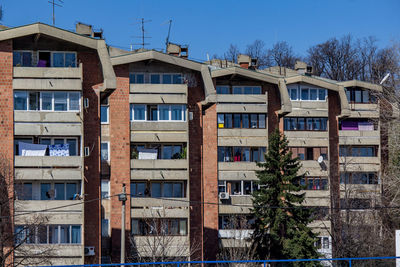 Low angle view of residential building against clear blue sky