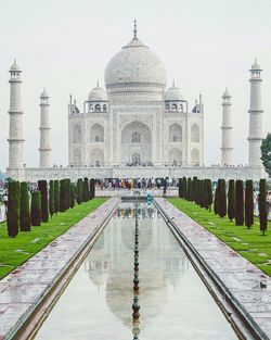 Reflection of taj mahal against clear sky