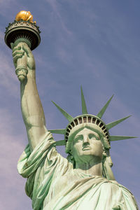 Low angle view of statue against sky