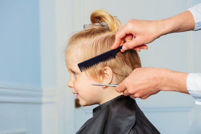 Cropped image of woman holding hair