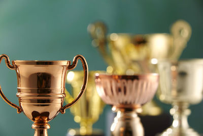 Close-up of trophy against green background