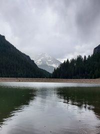 Scenic view of lake and mountains against sky