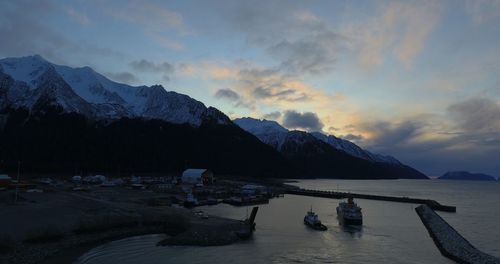 Scenic view of snowcapped mountains against sky during sunset