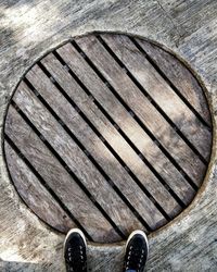 High angle view of shoes on wooden floor