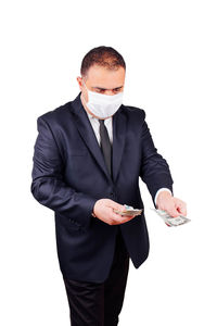 Young man wearing mask against white background