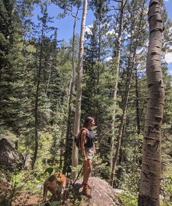 Woman with dog in forest