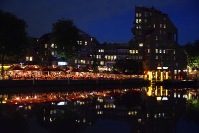 Reflection of illuminated buildings in water