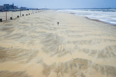 Scenic view of one person on the beach